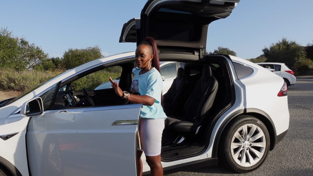 Naira Ali blessed with a brand new ride Tesla Model X Plaid by her management team