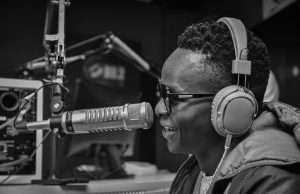 John Blaq speaking in a radio interview