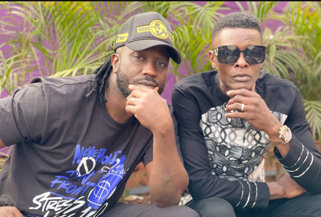 Bebe Cool and Jose Chameleone sharing a light moment