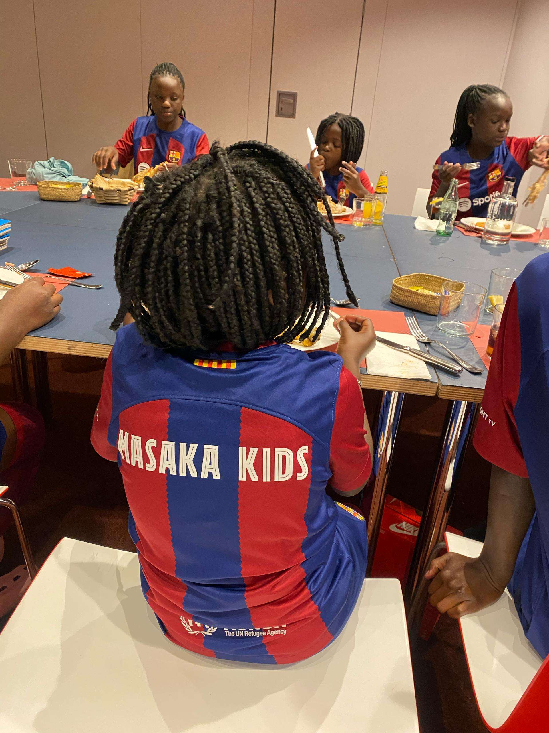 Masaka Kids Africana enjoying a meal